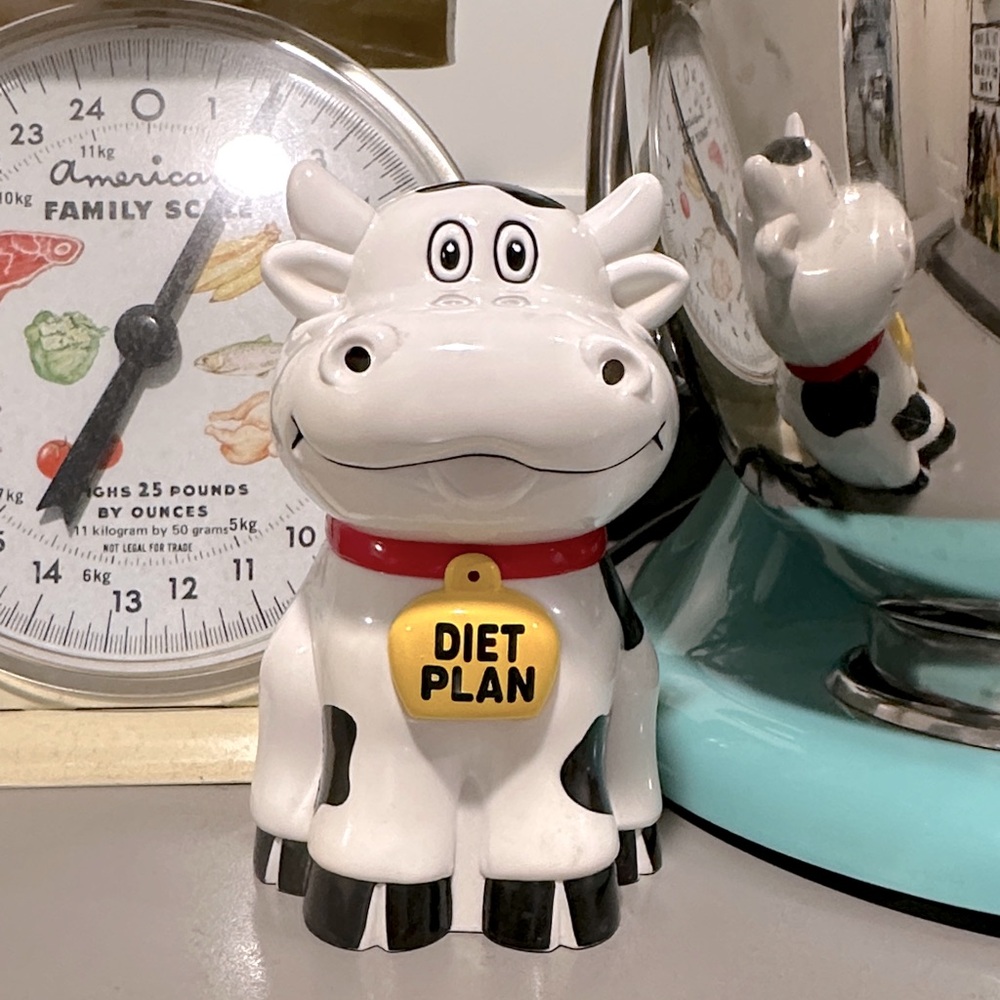 Ceramic Cow Coin Bank in White with Red Collar and Yellow Tag